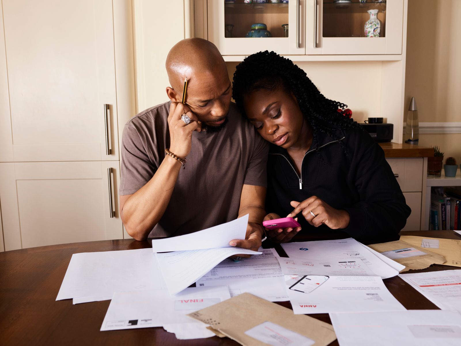 A couple at a table managing household finances