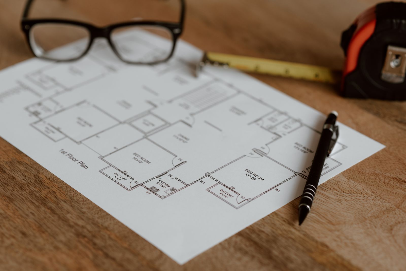 A scaled bathroom floor plan with a ruler and pencil