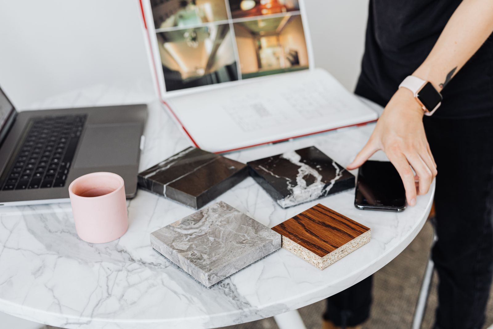 Interior design material samples laid out on a marble table