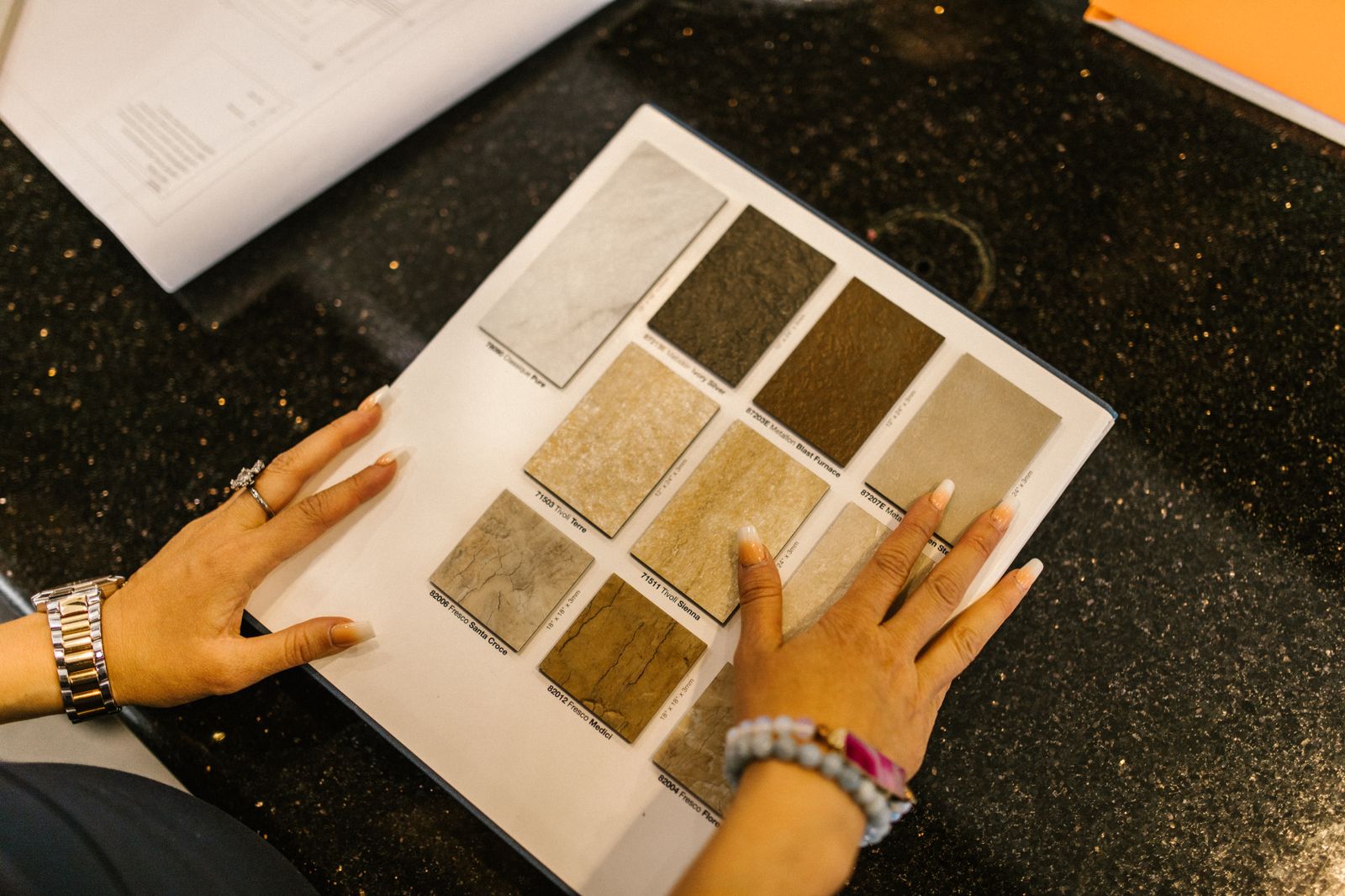 A designer reviewing stone samples in the showroom